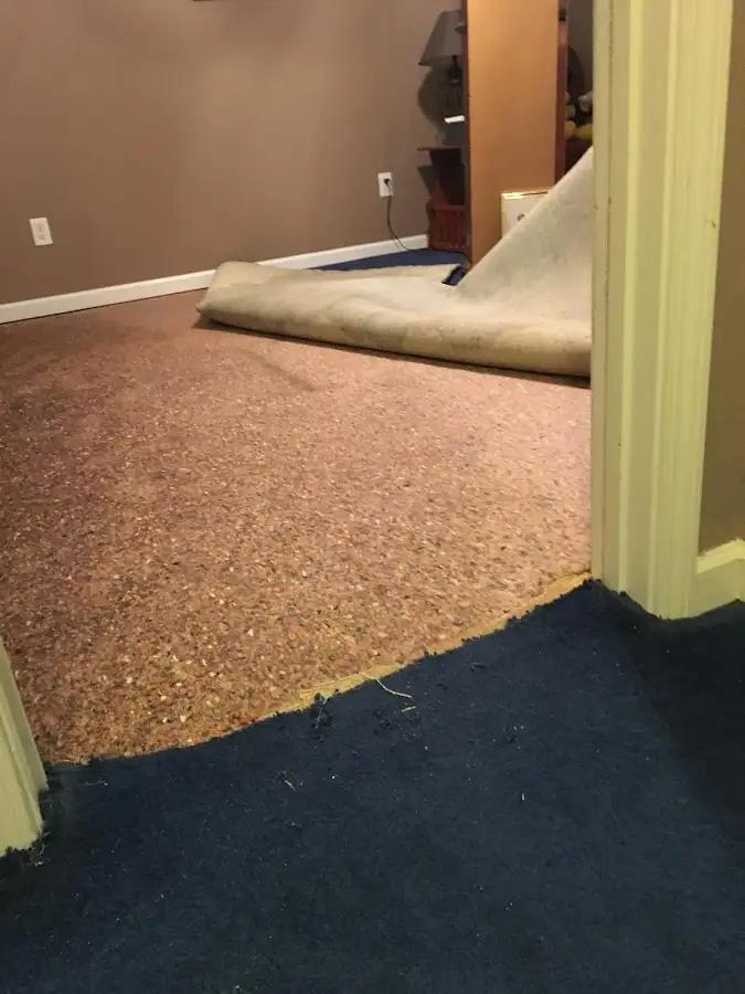 Carpet pad removal revealing water damage during Drying & Dehumidification in Lubbock