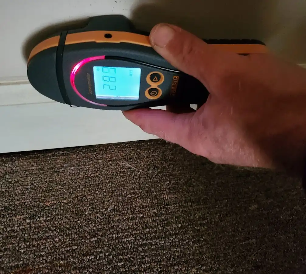 Moisture detection at baseboard during Burst Pipe Cleanup in Lubbock